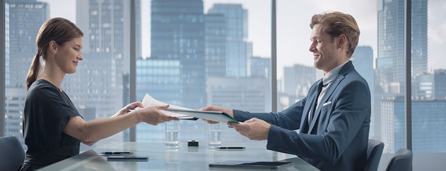 Business professionals signing company formation documents in Dubai Business professionals signing company formation documents in Dubai